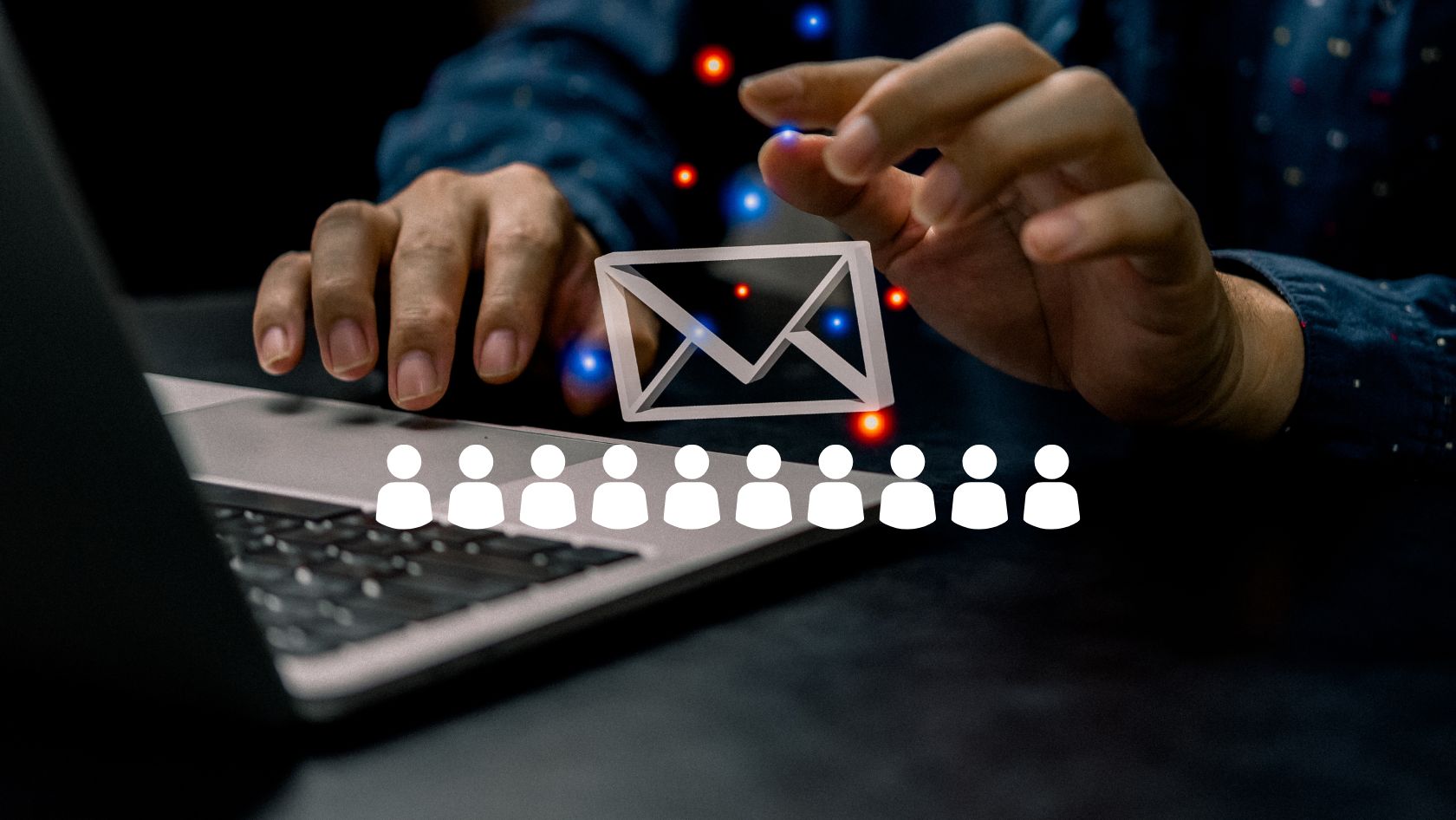 Hands over a laptop with a paper envelope icon between them, and a row of user icons below, symbolizing email or phishing targeting many people.