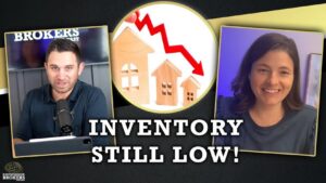 Podcast thumbnail: left man at microphone, center circular graphic of houses with a red down arrow, right smiling woman on video call; caption reads 'INVENTORY STILL LOW!'