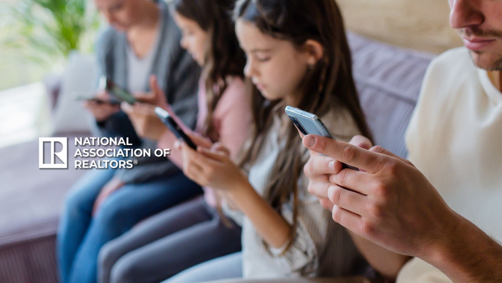 Group of people sitting on a couch using smartphones, with the National Association of Realtors logo in the foreground.
