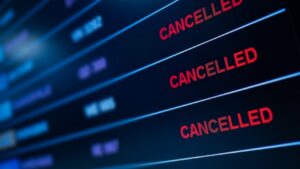 Screen showing a list with red 'CANCELLED' labels on each row against a dark blue background, indicating cancelled items or events.