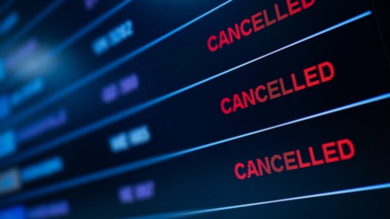Screen showing a list with red 'CANCELLED' labels on each row against a dark blue background, indicating cancelled items or events.