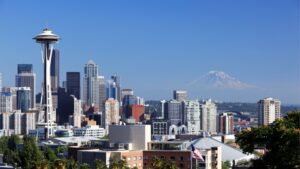 Seattle skyline with the Space Needle and distant Mount Rainier on a clear day.