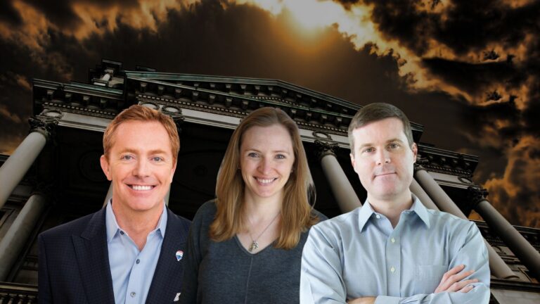 Three smiling professionals standing in front of a large neoclassical building with tall columns at sunset.